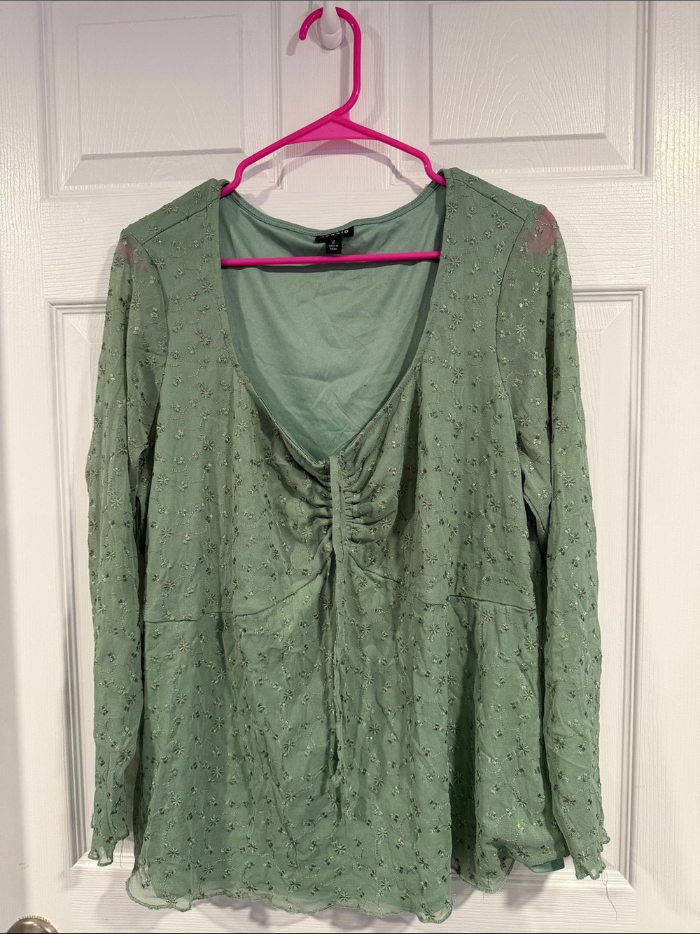 torrid sage green blouse with rounded neckline